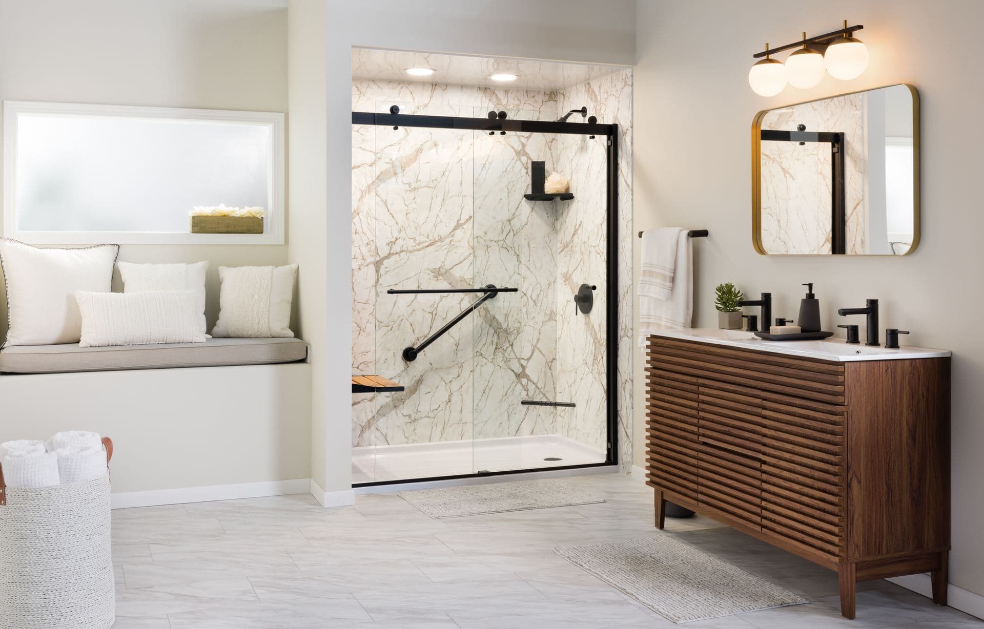 Modern bathroom with marble shower, glass doors, and black fixtures. Wooden vanity with twin sinks, large mirror, bench seating, neutral tones.